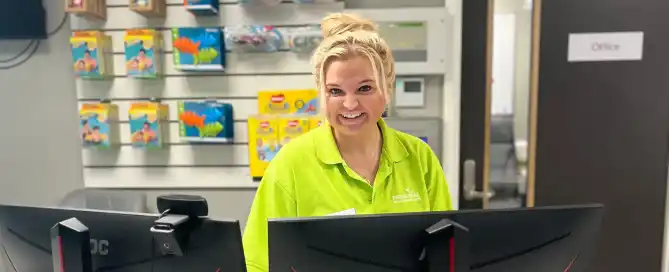 A woman working at a leisure centre reception