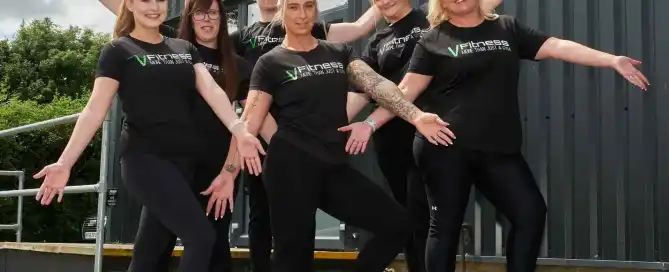 Six people posing outside VFitness